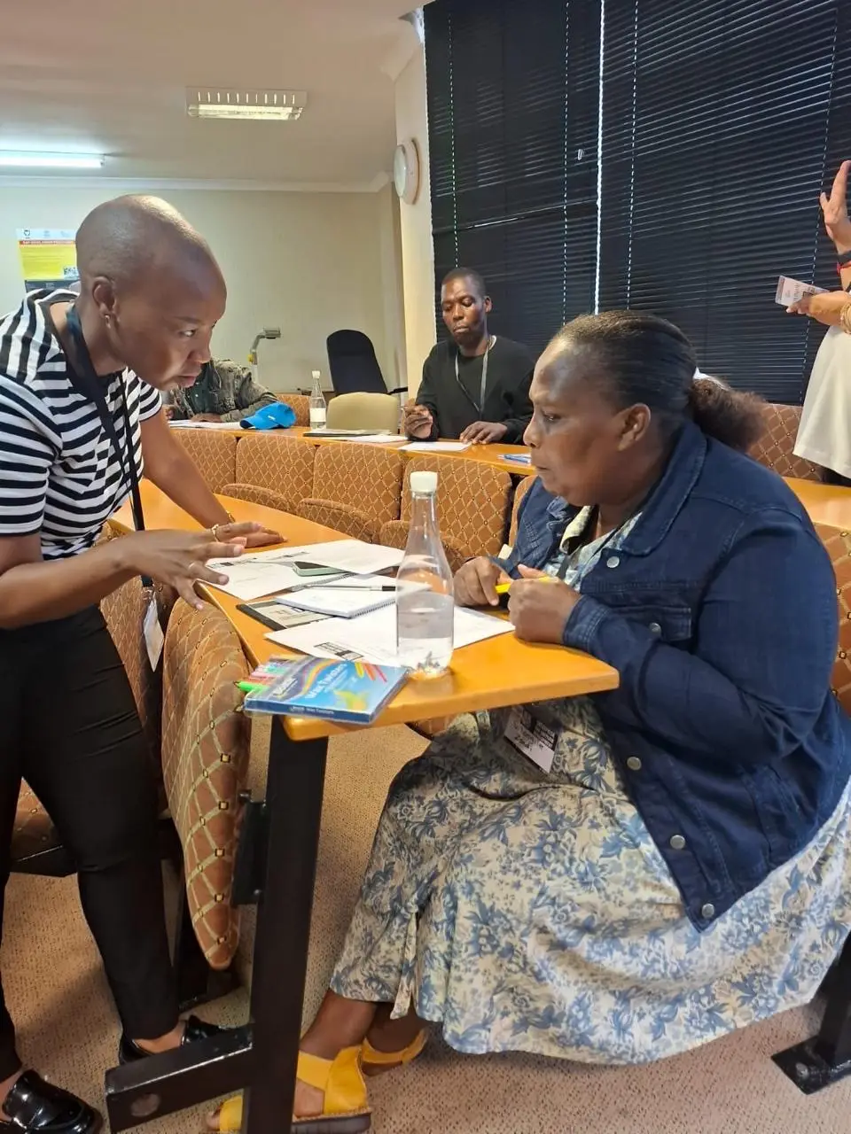 Entrepreneurs participating in a YIEDI SME development workshop, collaborating during a group activity